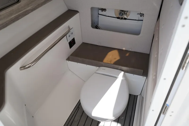 Slide: The Image of Interior compartment of 2025 Edgewater 248 CX boat, showcasing storage space. - 22