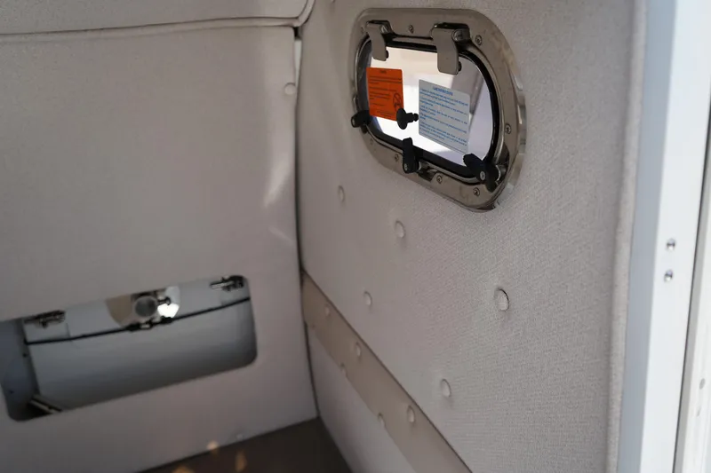 Slide: The Image of Interior of 2025 Edgewater 248 CX boat, featuring sleek cabinetry and modern design elements. - 24