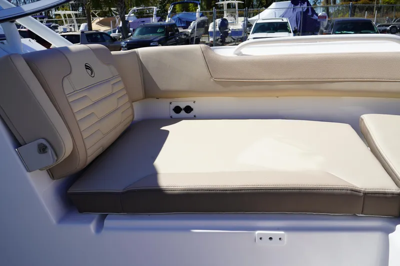 Slide: The Image of Open storage compartment on 2025 Edgewater 248 CX boat, featuring spacious interior design. - 34