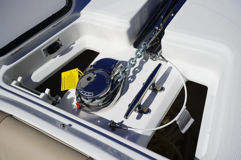 Slide: The Image of 2025 Edgewater 248 CX boat hatch with textured surface and secure latch. - 45