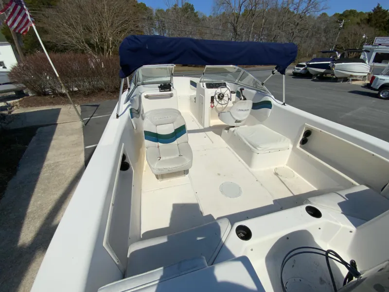 Slide: The Image of 1997 Seaswirl Striper 2100 DC boat interior with seating and steering wheel. - 10