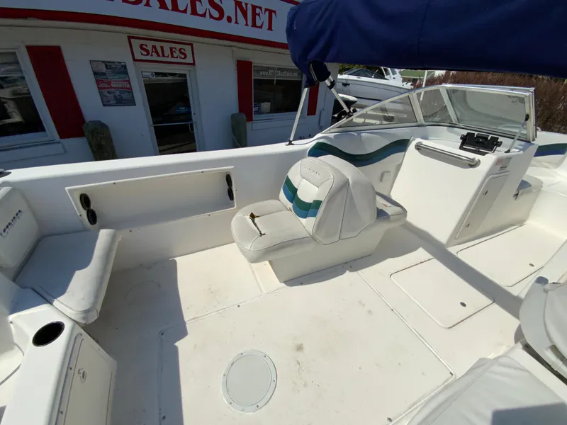Slide: The Image of 1997 Seaswirl Striper 2100 DC boat interior with seating and steering console. - 11