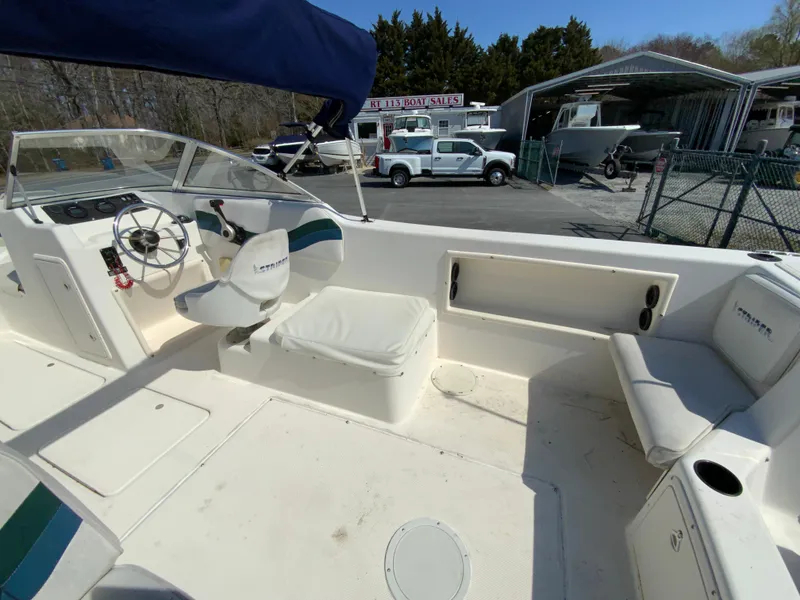 Slide: The Image of 1997 Seaswirl Striper 2100 DC boat interior with seating and steering wheel. - 12