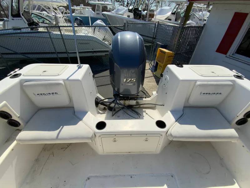 Slide: The Image of 1997 Seaswirl Striper 2100 DC boat with 175 HP engine, docked in marina. - 15