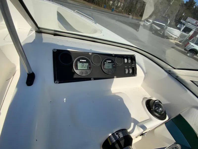 Slide: The Image of 1997 Seaswirl Striper 2100 DC dashboard with Yamaha gauges and controls. - 20