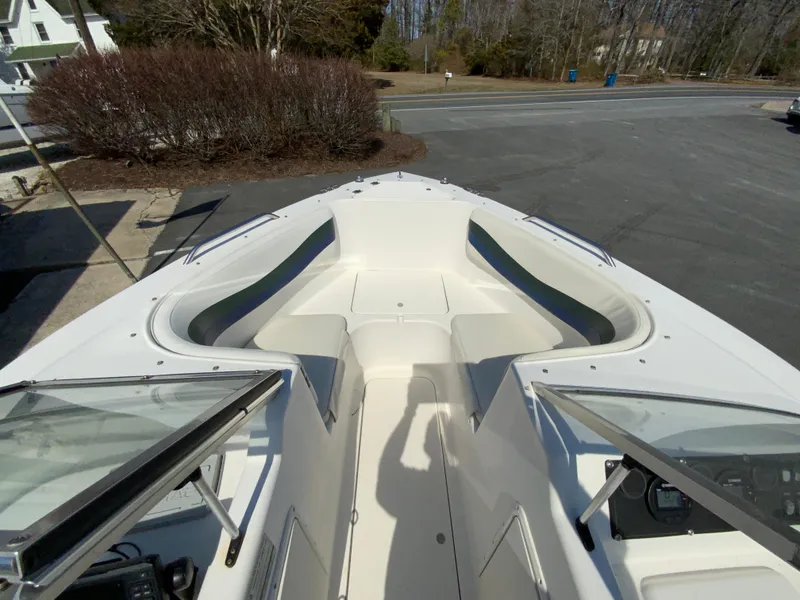 Slide: The Image of 1997 Seaswirl Striper 2100 DC boat interior with open bow seating and windshield. - 24