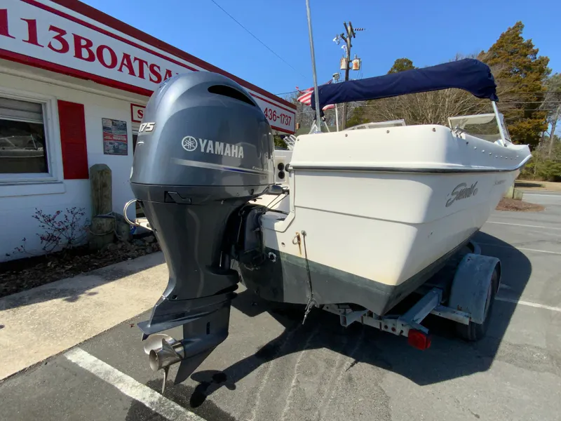 Slide: The Image of 1997 Seaswirl Striper 2100 DC boat with Yamaha outboard motor on trailer. - 9