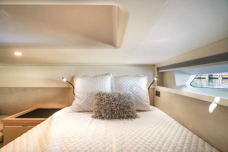 Slide: The Image of Luxurious cabin interior of 2022 Solaris Power yacht, featuring a cozy bed and modern lighting. - 20