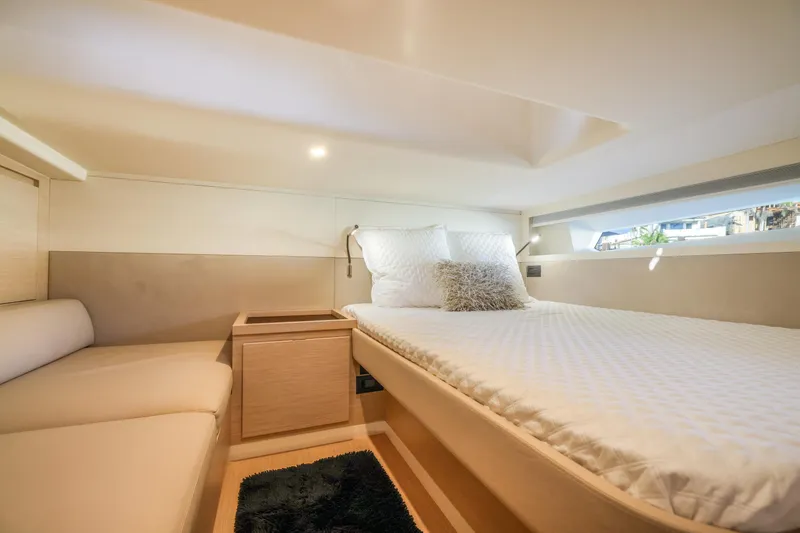 Slide: The Image of Luxurious cabin interior of 2022 Solaris Power yacht, featuring a comfortable bed and modern design. - 21