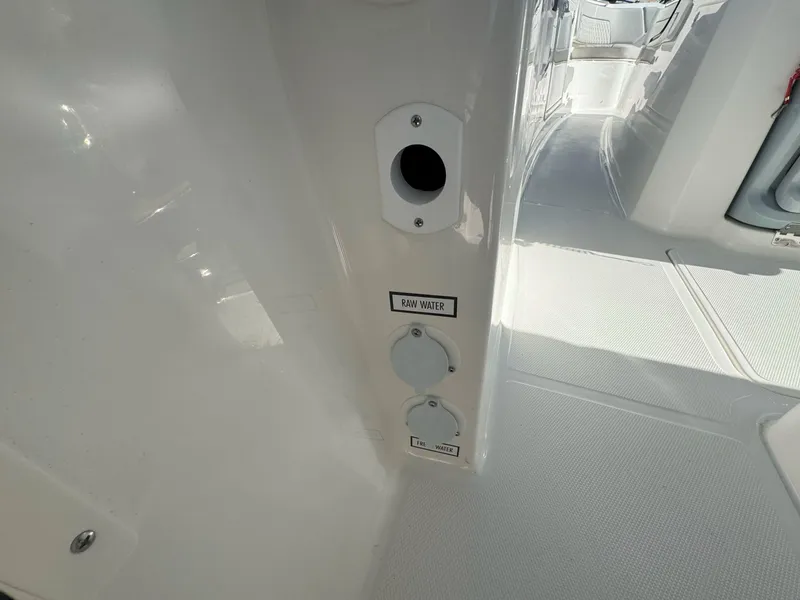 Slide: The Image of 2025 Pursuit S 328 boat interior showing raw water access panel. - 20
