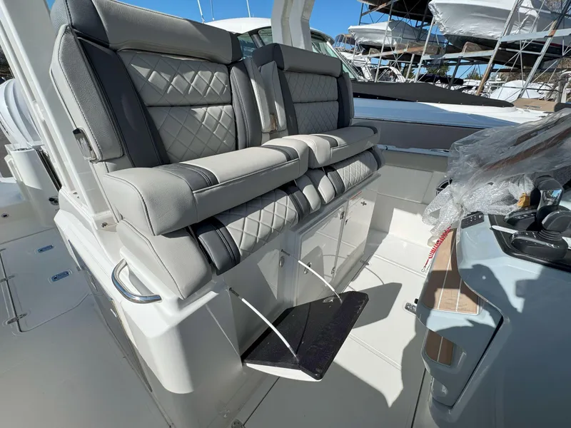 Slide: The Image of 2025 Pursuit S 328 boat interior with luxurious seating and modern design. - 24
