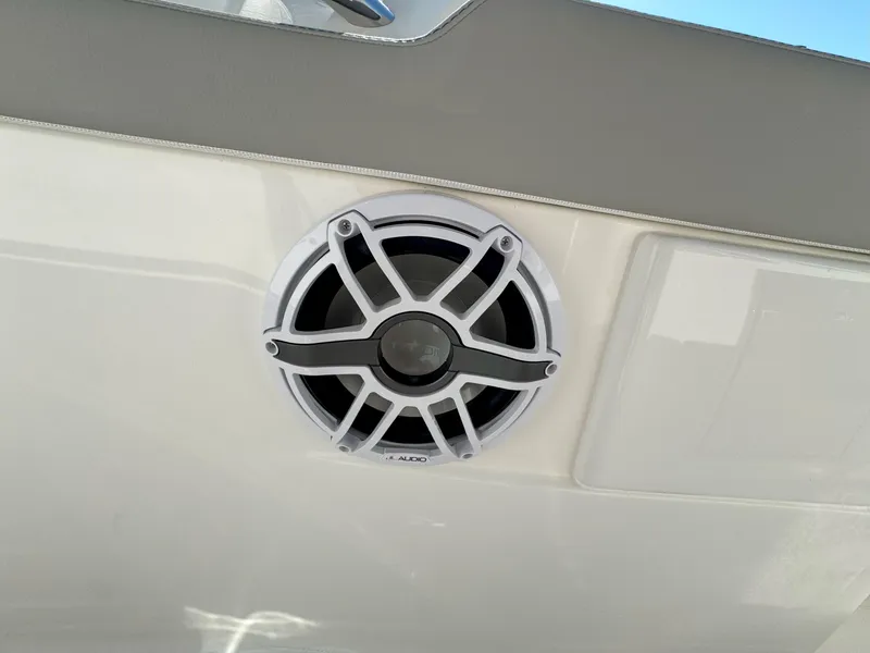 Slide: The Image of Marine speaker on 2025 Pursuit S 328 boat, white exterior. - 30