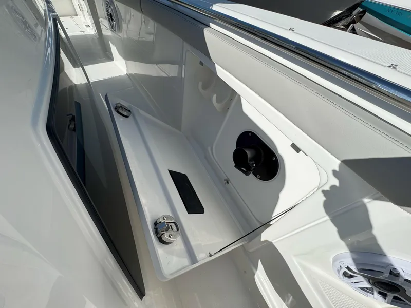 Slide: The Image of 2025 Pursuit S 328 boat interior storage compartment with open hatch. - 36