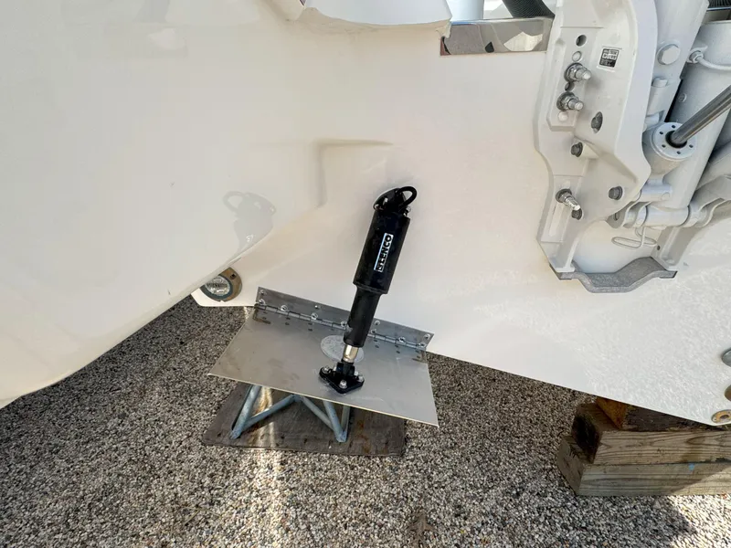 Slide: The Image of 2025 Pursuit S 328 boat trim tab mechanism on display. - 6