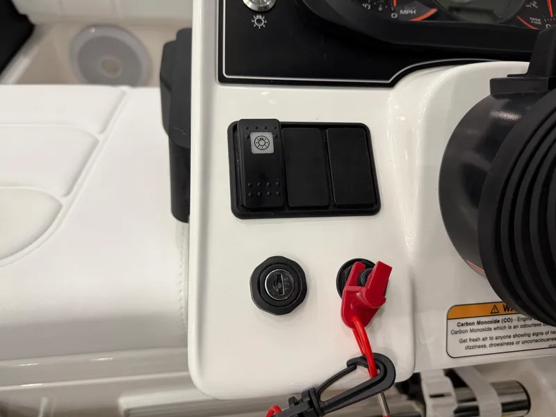 Slide: The Image of 2024 Williams Jet Tenders Sportjet 345 dashboard controls with ignition and safety features. - 17