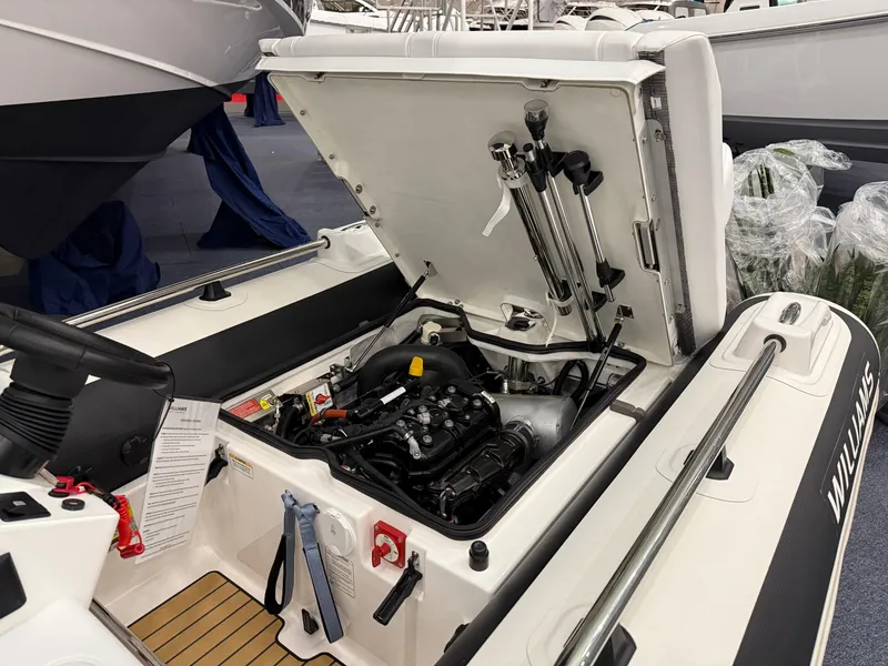 Slide: The Image of 2024 Williams Jet Tenders Sportjet 345 engine compartment, showcasing open engine hatch. - 18