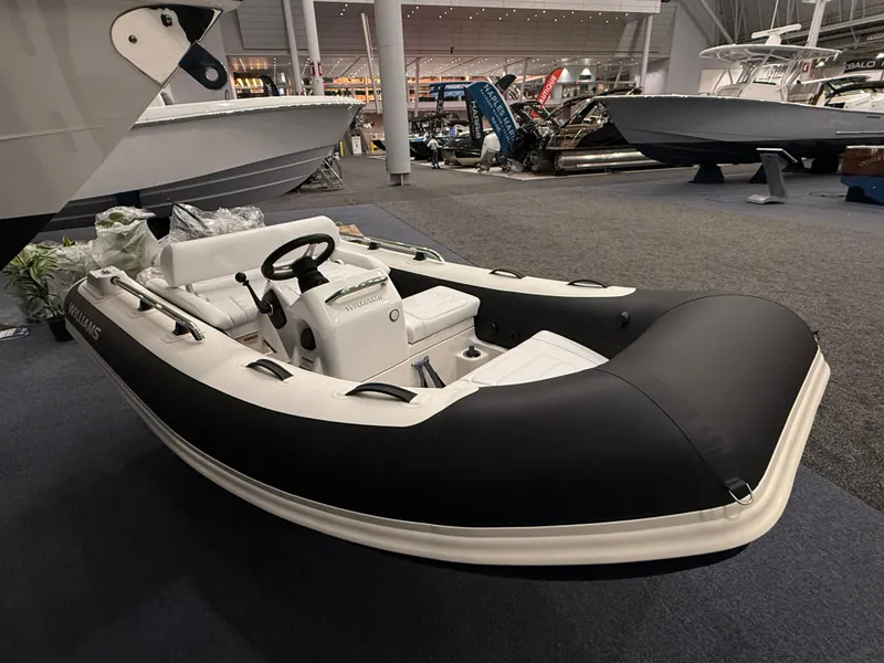 Slide: The Image of 2024 Williams Jet Tenders Sportjet 345 displayed indoors at a boat show. - 3