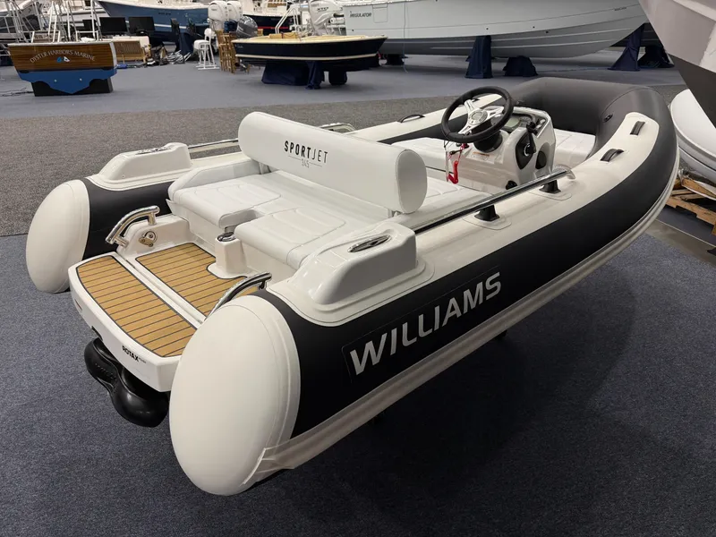 Slide: The Image of 2024 Williams Jet Tenders Sportjet 345, sleek design, displayed indoors. - 5