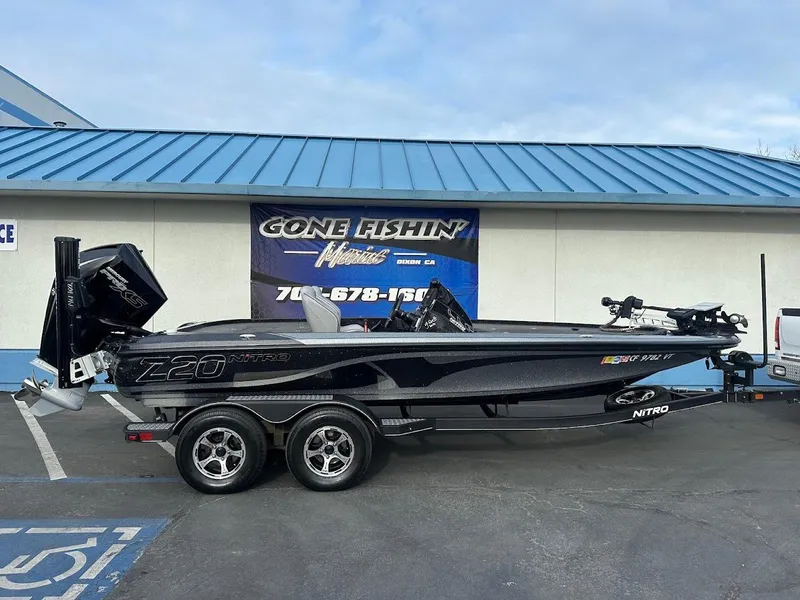 Slide: The Image of 2021 Nitro Z20 Pro fishing boat on trailer, parked outside dealership. - 1