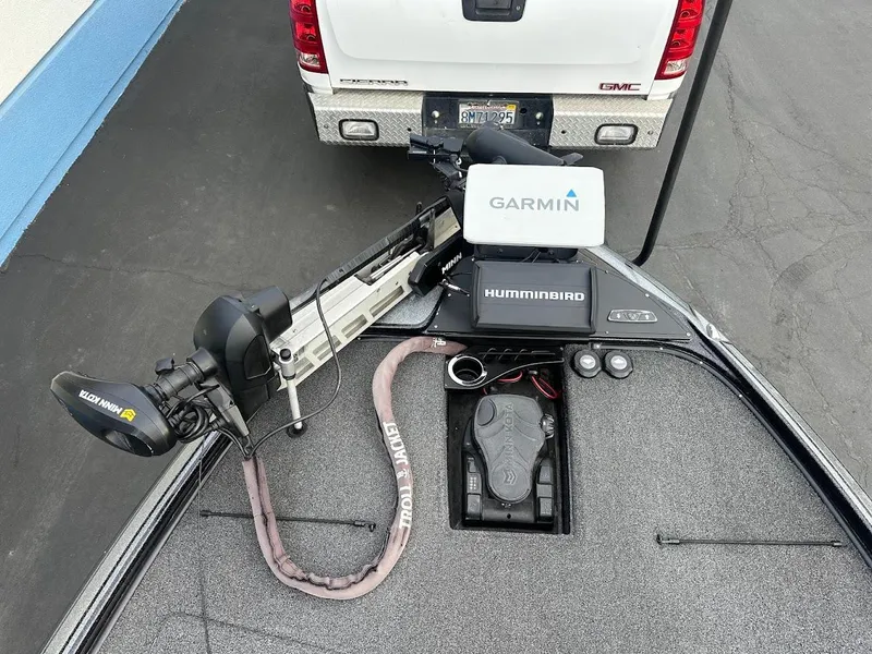 Slide: The Image of Nitro Z20 Pro 2021 boat with Garmin and Humminbird equipment, parked behind a GMC vehicle. - 19