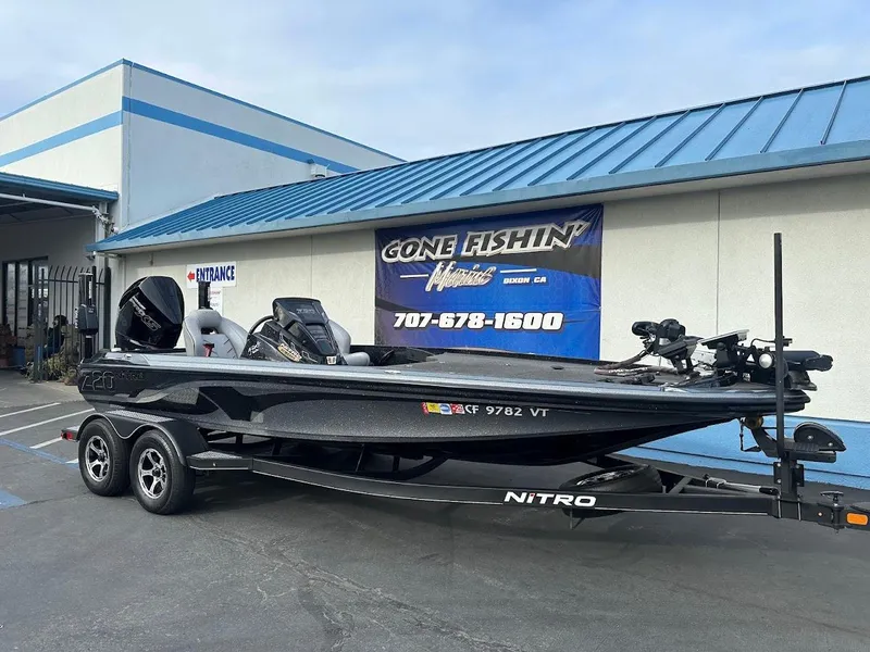 Slide: The Image of 2021 Nitro Z20 Pro boat on trailer outside dealership. - 2