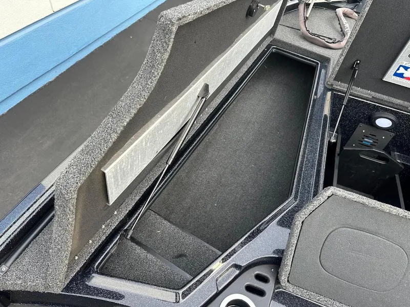 Slide: The Image of Open storage compartment in a 2021 Nitro Z20 Pro boat. - 24