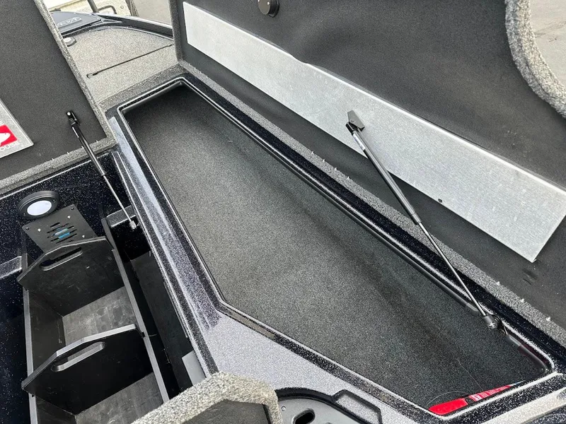 Slide: The Image of Open storage compartment in a 2021 Nitro Z20 Pro boat. - 26