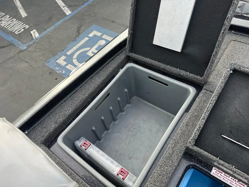 Slide: The Image of Storage compartment in a 2021 Nitro Z20 Pro boat, open and empty. - 29