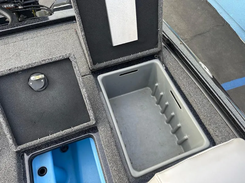 Slide: The Image of Storage compartments in a 2021 Nitro Z20 Pro boat, featuring a gray and blue interior. - 31