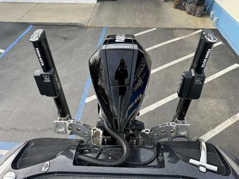 Slide: The Image of 2021 Nitro Z20 Pro boat engine with dual Minn Kota Talon anchors in a parking lot. - 33