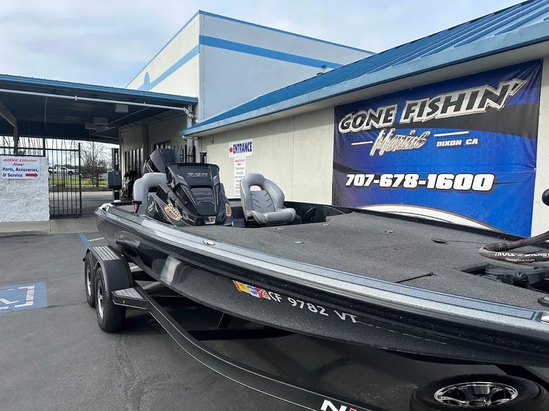Slide: The Image of 2021 Nitro Z20 Pro fishing boat parked outside dealership with "Gone Fishin'" sign. - 4