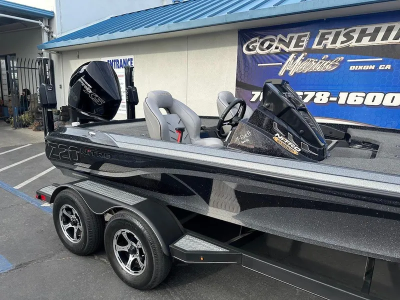 Slide: The Image of Nitro Z20 Pro 2021 fishing boat with dual seats and motor, parked outside dealership. - 5