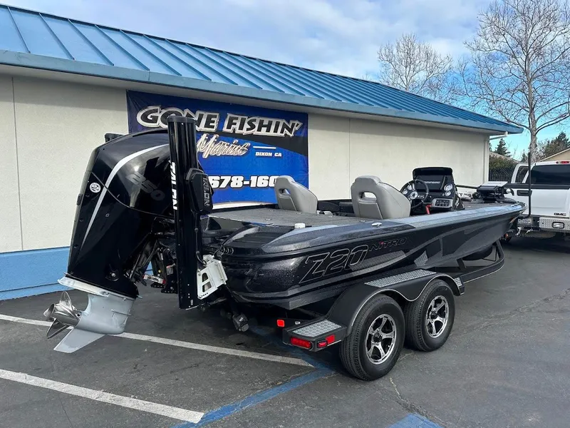 Slide: The Image of 2021 Nitro Z20 Pro boat parked outside dealership, featuring sleek design and powerful engine. - 7