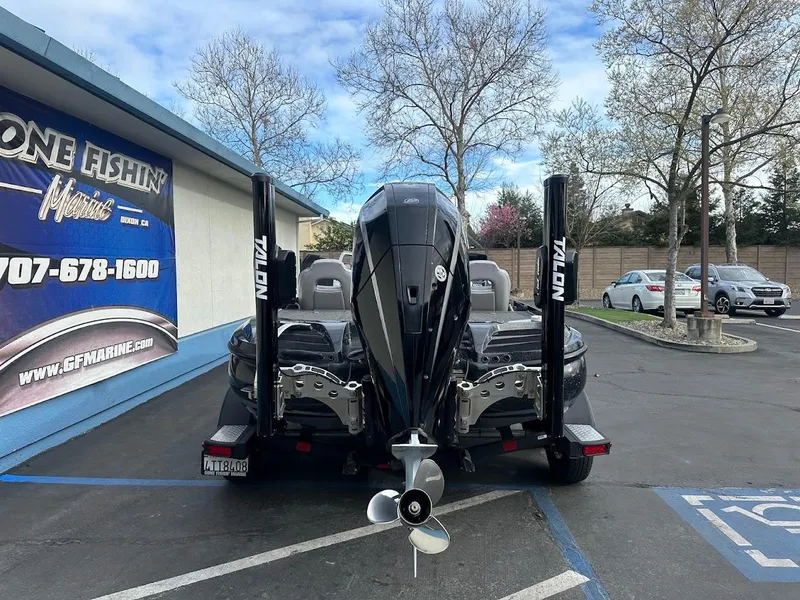 Slide: The Image of Nitro Z20 Pro 2021 boat parked outside fishing store, rear view. - 8