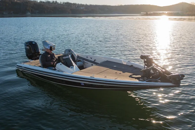 Slide: The Image of 2017 Phoenix 618 Pro boat on a serene lake at sunset. - 13