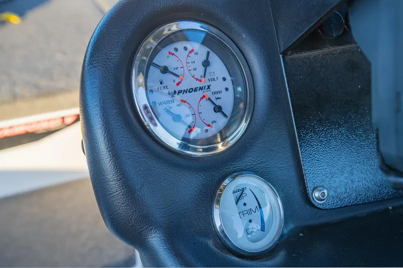 Slide: The Image of Dashboard gauges of a 2017 Phoenix 618 Pro boat, showing fuel and trim levels. - 21
