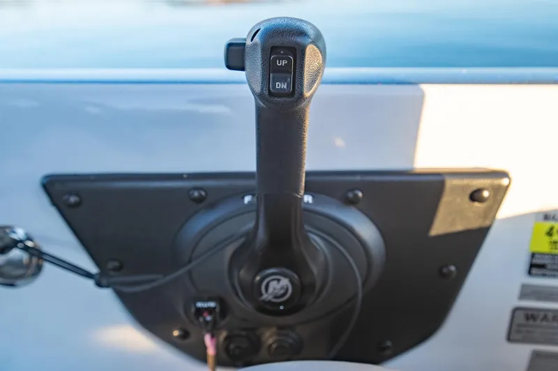 Slide: The Image of Close-up of a 2017 Phoenix 618 Pro boat throttle control lever. - 22