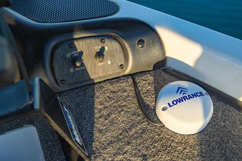 Slide: The Image of Control panel and Lowrance device in 2017 Phoenix 618 Pro boat interior. - 25