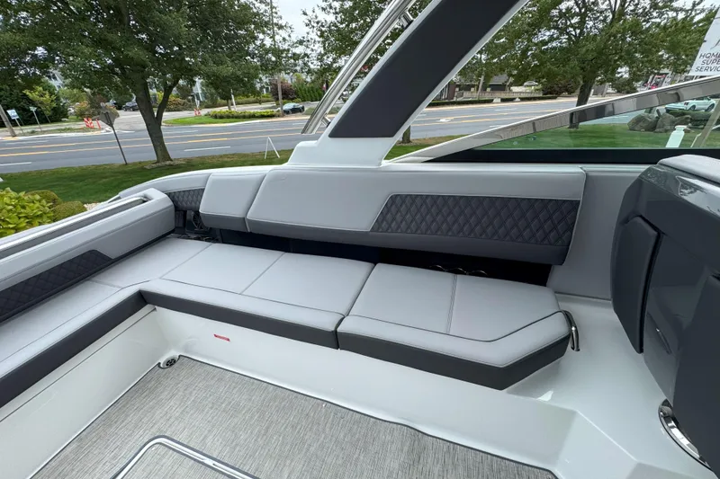 Slide: The Image of 2025 Cobalt R33 OB boat interior with sleek gray seating and modern design. - 10