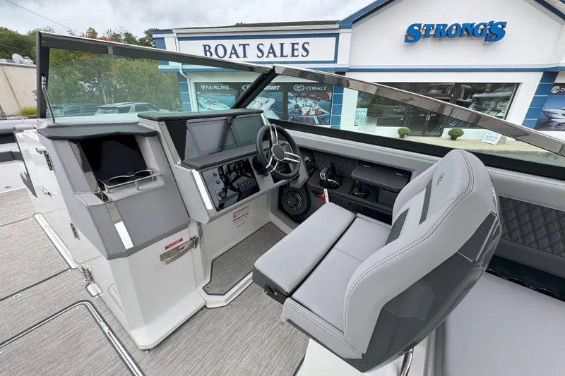 Slide: The Image of Interior of 2025 Cobalt R33 OB boat at Strong's Marine dealership. - 13