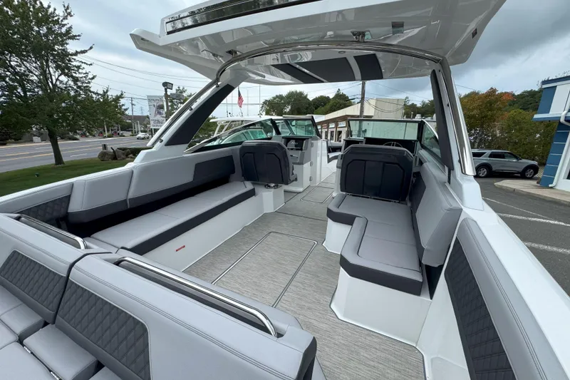 Slide: The Image of 2025 Cobalt R33 OB boat interior with sleek seating and modern design. - 8
