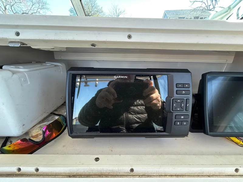 Slide: The Image of Garmin navigation system on 1997 Pro-Line 2810 Walkaround boat dashboard. - 18