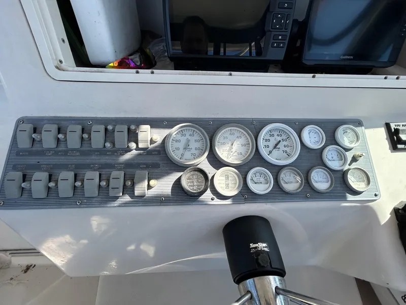Slide: The Image of Control panel of a 1997 Pro-Line 2810 Walkaround boat with gauges and switches. - 20