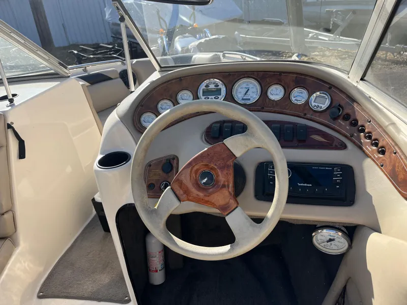 Slide: The Image of Steering wheel and dashboard of 2000 Tigé 2100V Limited boat. - 3