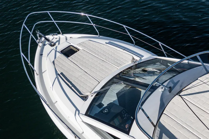Slide: The Image of 2019 Absolute 45 FLY yacht deck, featuring sleek design and luxurious sunbathing area. - 18