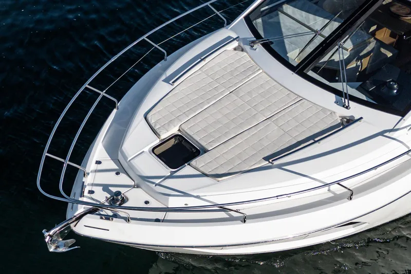 Slide: The Image of Absolute 45 FLY 2019 yacht bow with sunbathing area on calm water. - 19