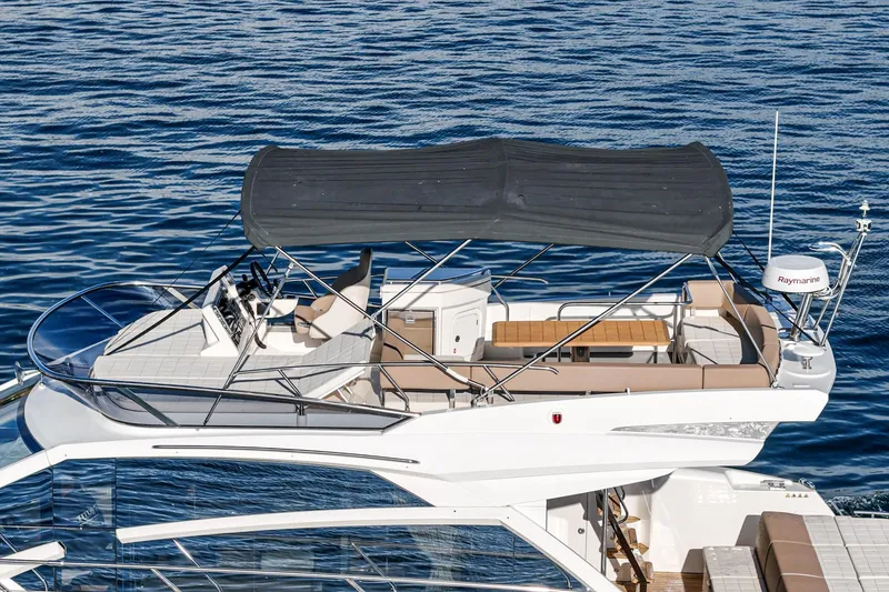 Slide: The Image of 2019 Absolute 45 FLY yacht with flybridge, cruising on calm blue waters. - 24