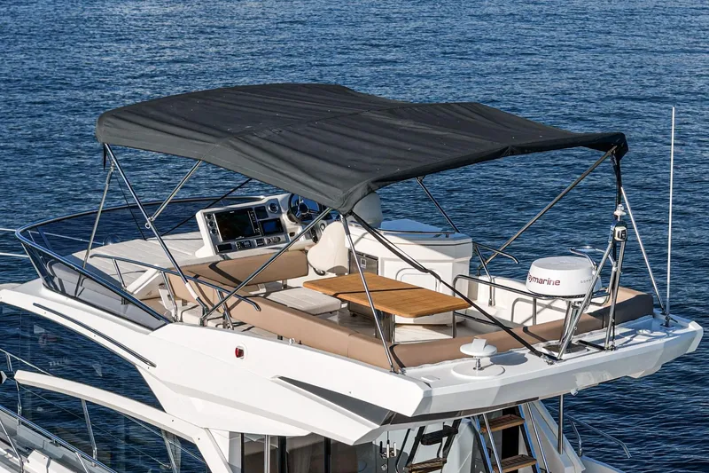 Slide: The Image of Flybridge of 2019 Absolute 45 FLY yacht with canopy and seating area. - 25