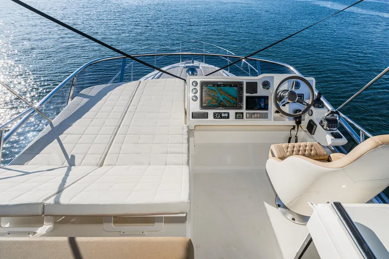 Slide: The Image of Flybridge of 2019 Absolute 45 FLY yacht with navigation controls and seating. - 27