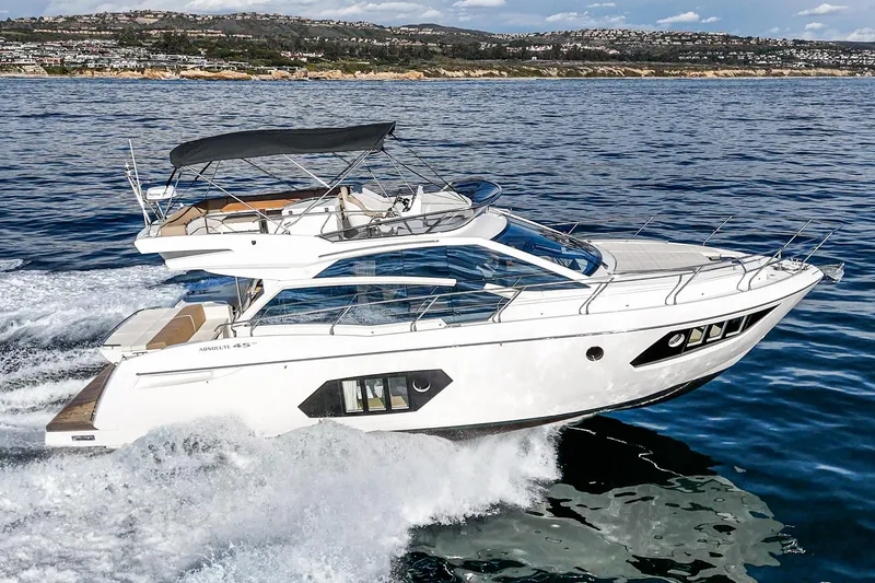 Slide: The Image of 2019 Absolute 45 FLY yacht cruising on open water, showcasing sleek design and luxury. - 3